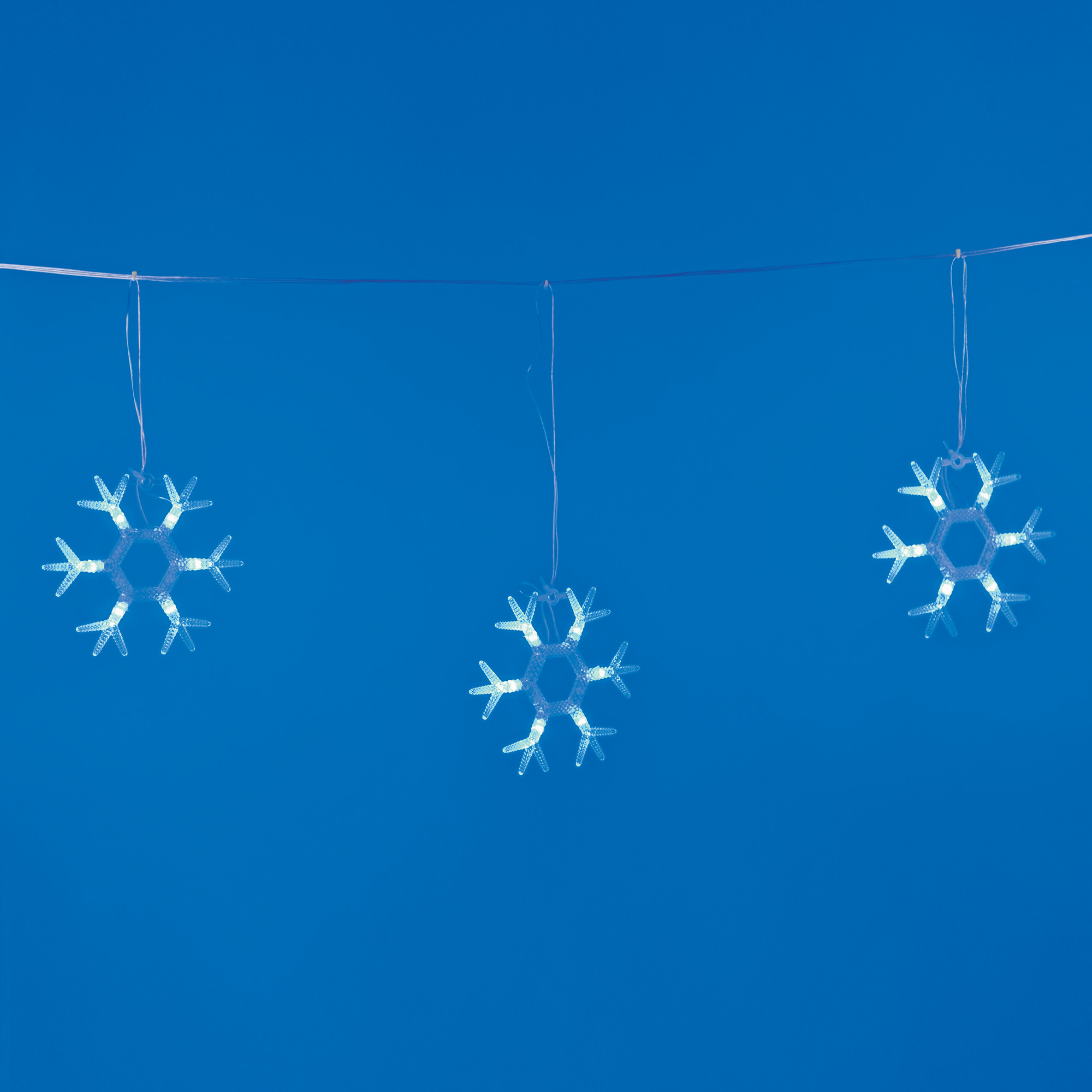 ULD-E1503-036-DTA BLUE IP20 SNOWFLAKES-1 Занавес светодиодный фигурный Снежинки-1. 1.5х0.3м. 6 подвесов. 36 светодиодов. Синий свет. Провод прозрачный. TM Uniel.